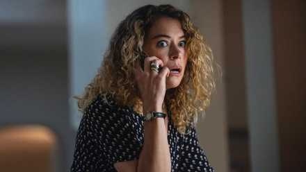 Tatiana Maslany wide-eyed on the phone in Maximum Pleasure Guaranteed