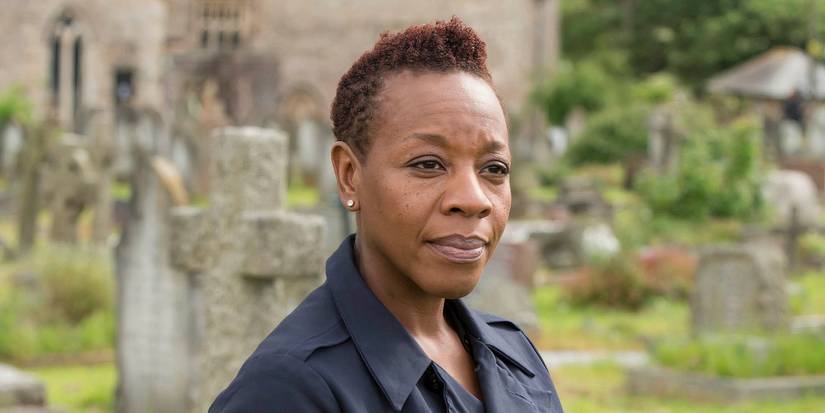 Marianne Jean-Baptiste as Sharon Bishop standing in a graveyard in 'Broadchurch'