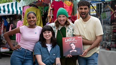 A group of people - Shini Muthukrishnan, Abby Cook, Julie Wilson Nimmo and Shabaz Ali - pose together in the Bridge Street market set on the EastEnders lot. Shabaz holds a record for Later... with Jools Holland