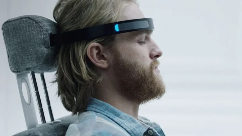 Wyatt Russell's Cooper with his head attached to a technological device on Black Mirror
