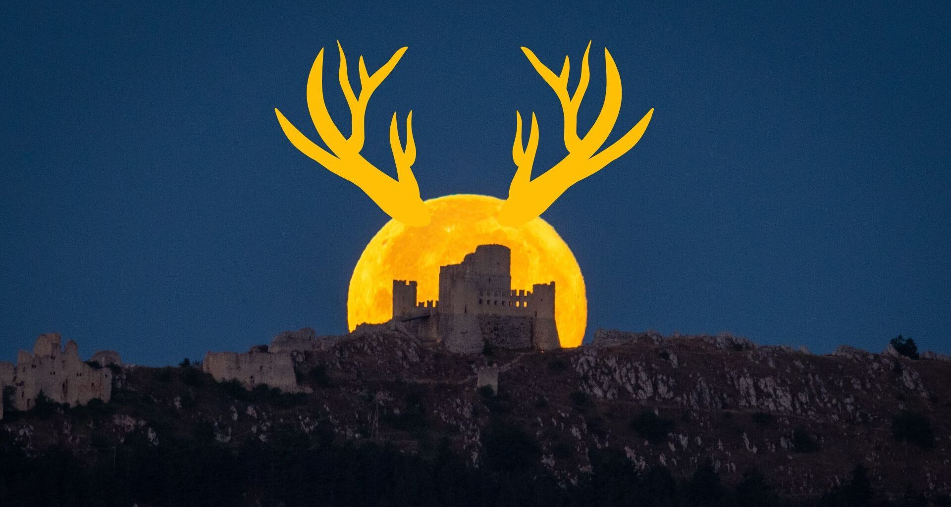 A yellow-orange full moon with antler-like horns rises behind a castle on a hillside in a dark sky.