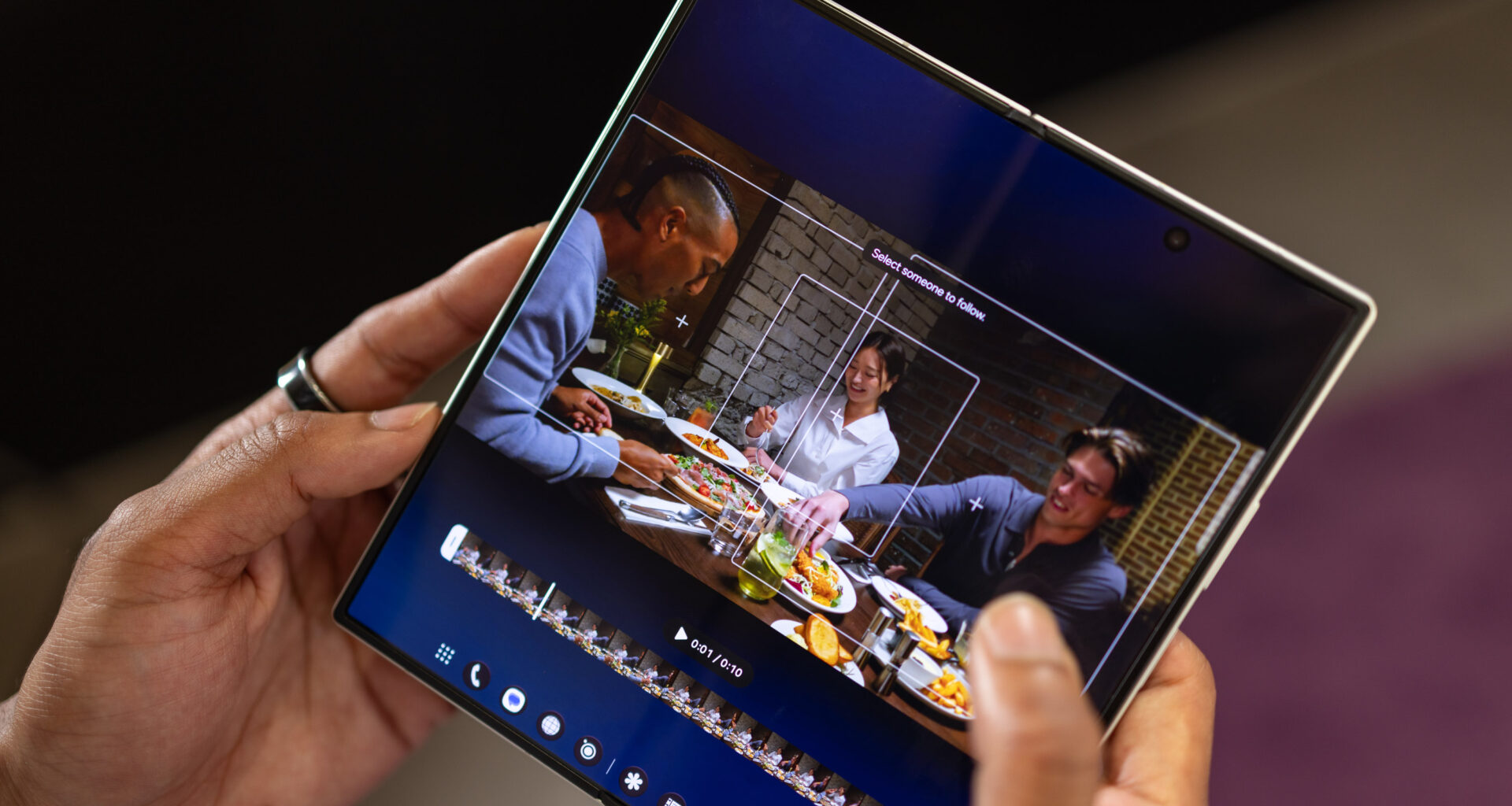 Image showing an AI cropping tool on a foldable phone