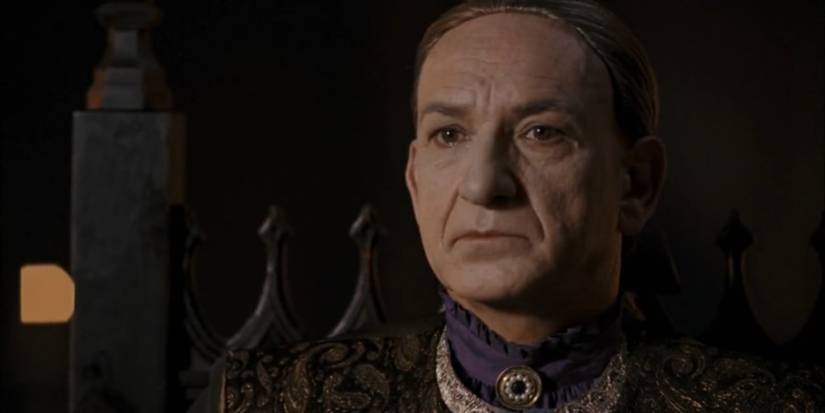 Sir Ben Kingsley in a purple shirt and a wig as Kagan in 'BloodRayne'