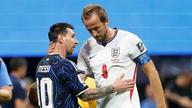 Argentina's Lionel Messi and England's Harry Kane embrace at full time (AP Photo/Erik S. Lesser)