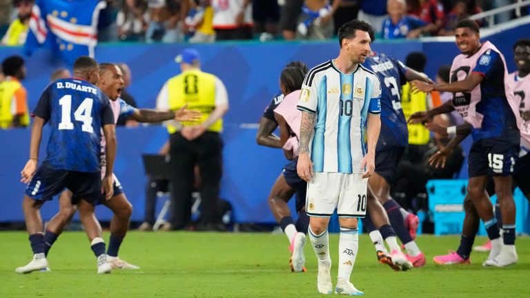 Argentina's Lionel Messi reacts as Cape Verde players celebrate their second goal scored by Cape Verde's Sidny Lopes Cabral