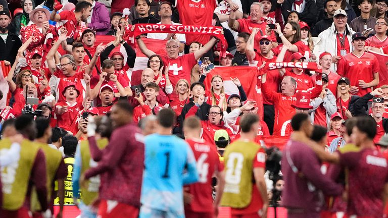 Swiss fans react towards their team following during the World Cup round of 32 soccer match between Switzerland and Algeria in Vancouver, British Columbia, Thursday, July 2, 2026. (AP Photo/Lindsey Wasson)
