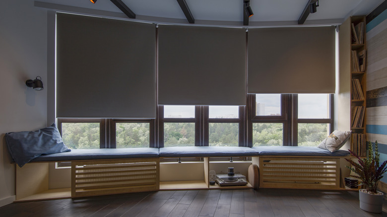 An open living space with the shades partially drawn