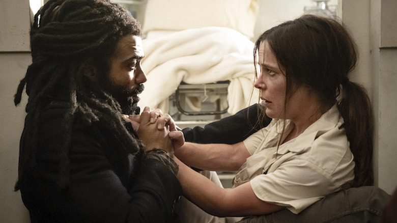 Andre (Daveed Diggs) and Josie (Katie McGuinness) holding hands on 
