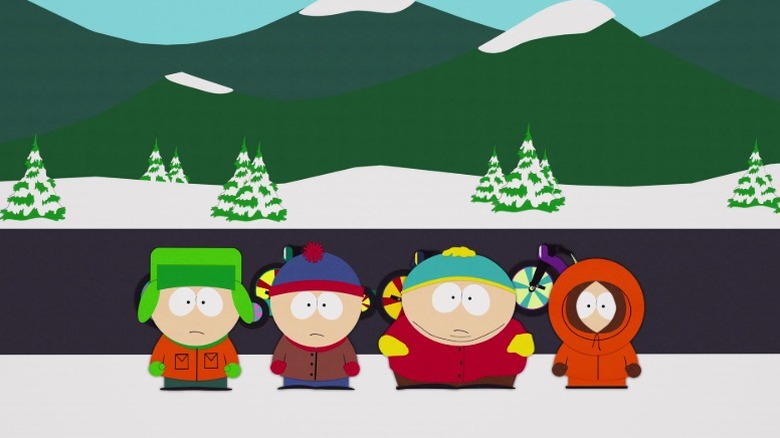 Kyle, Stan, Cartman, and Kenny standing on a sidewalk on South Park S8E6