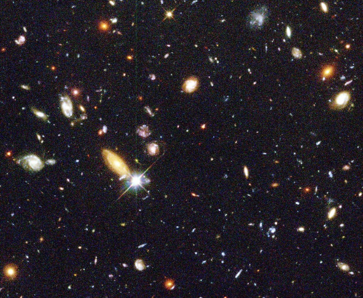 In 1995, astronomers pointed Hubble at a patch of sky so dark it looked empty and held it there for ten days. The image that came back contained roughly 3,000 galaxies — not stars, but galaxies — many holding billions of stars of their own.