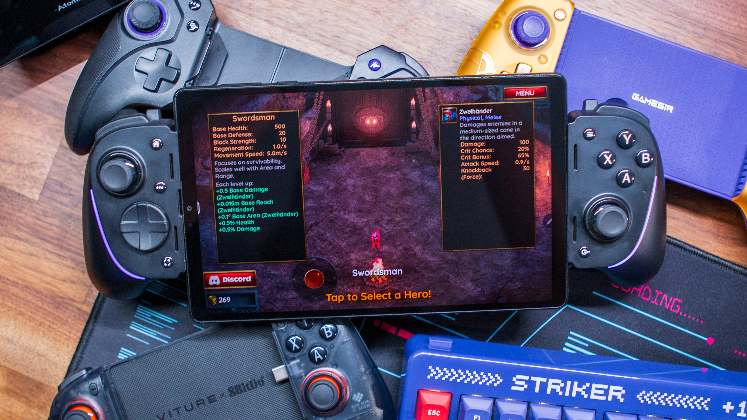 Lenovo Legion Tab Gen 3 playing Halls of Torment connected to Razer Kishi Ultra with other controllers in the background