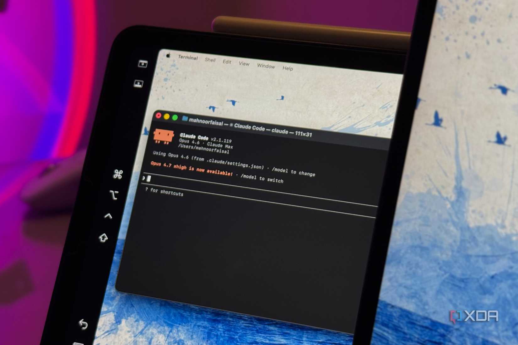 terminal window showing claude code editor with syntax highlighting on a tablet device