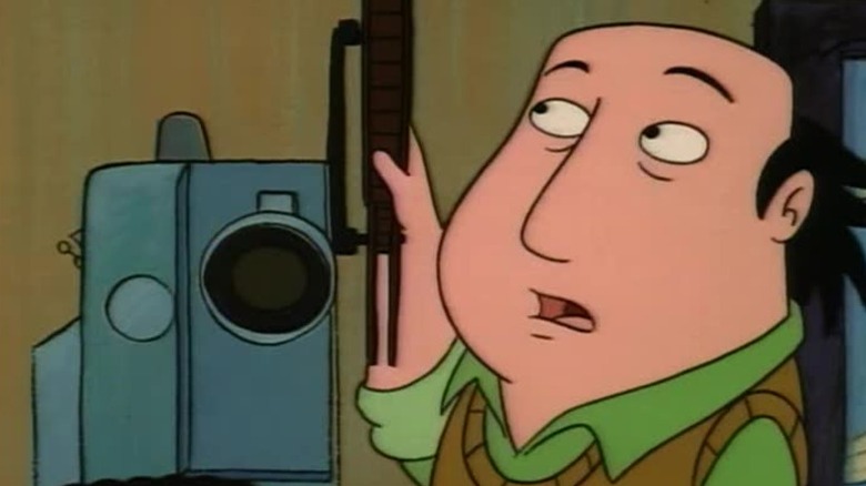 Jay standing next to a projector on The Critic S1E6