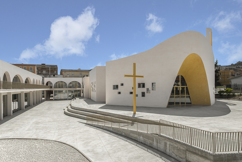a flowing roof and fluid concrete walls frame the new santa barbara parish complex in sicily - 2