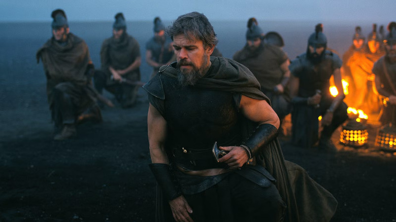 Odysseus on the beaches of hades with his men behind him in The Odyssey