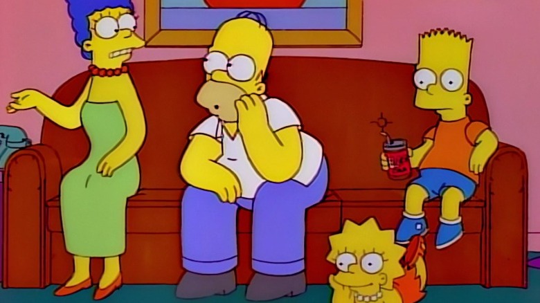 Marge, Homer, Lisa, and Bart sitting in the living room on The Simpsons S8E2