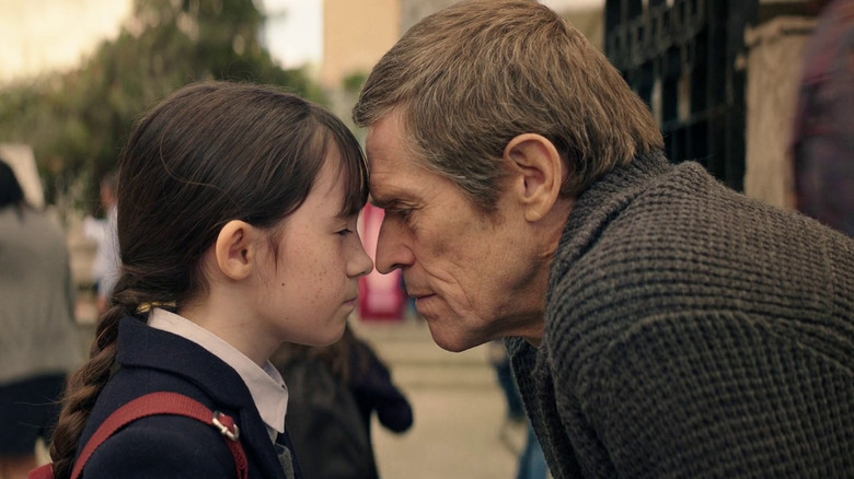 Terrence Settman with one of his granddaughters at the school gate