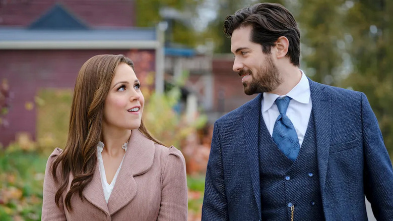 Elizabeth Thatcher (Erin Krakow) glances at Lucas Bouchard (Chris McNally) in When Calls the Heart