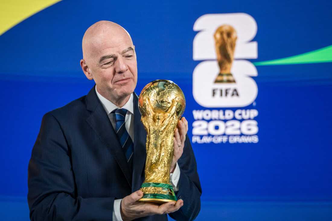 FIFA President Gianni Infantino poses with the World Cup trophy following the 2026 FIFA World Cup European Play-Off draw at the FIFA's Home of Football in Zurich on Nov. 20, 2025.