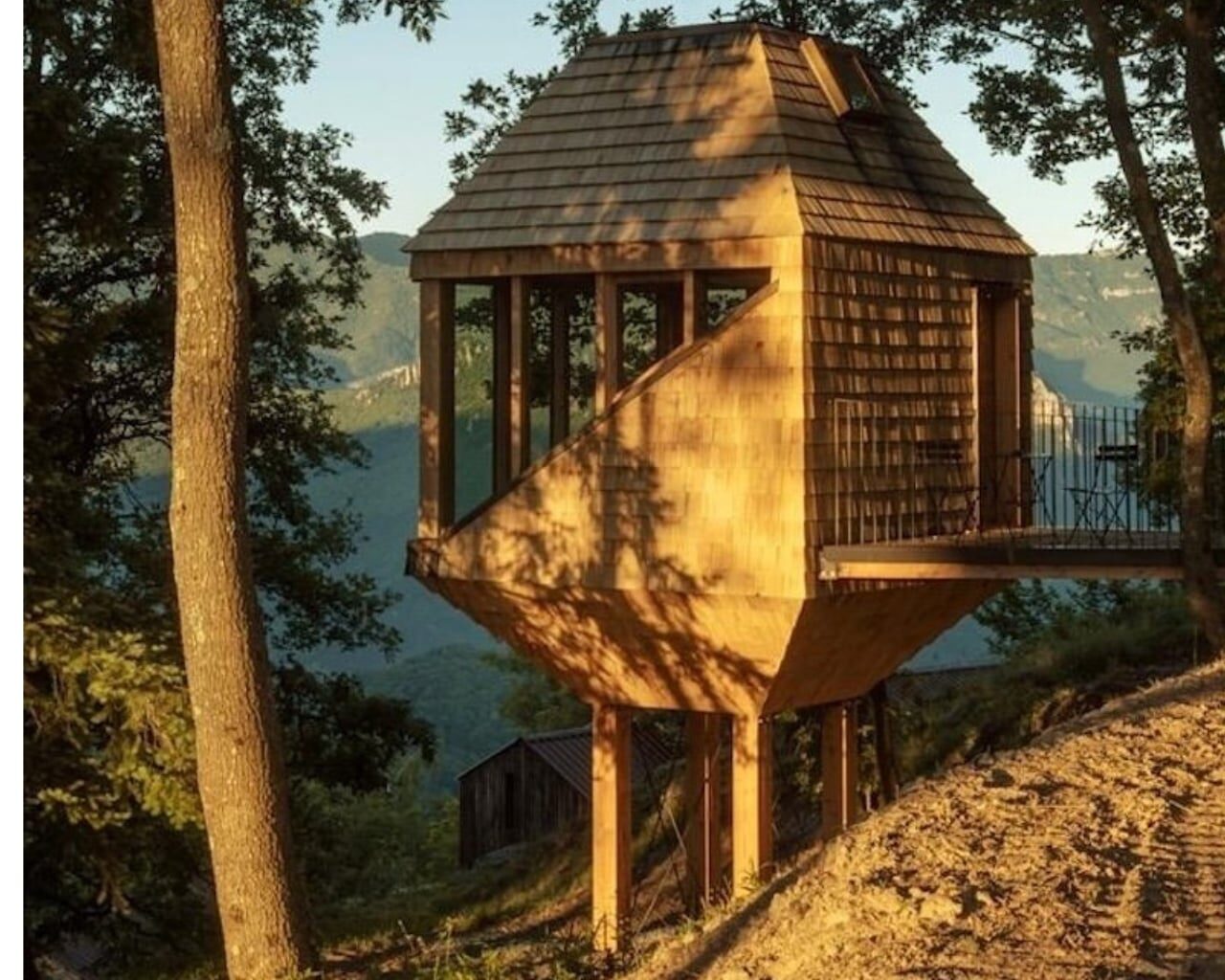 A Barn-Inspired Treehouse in the Italian Alps With a Rope Net Bed