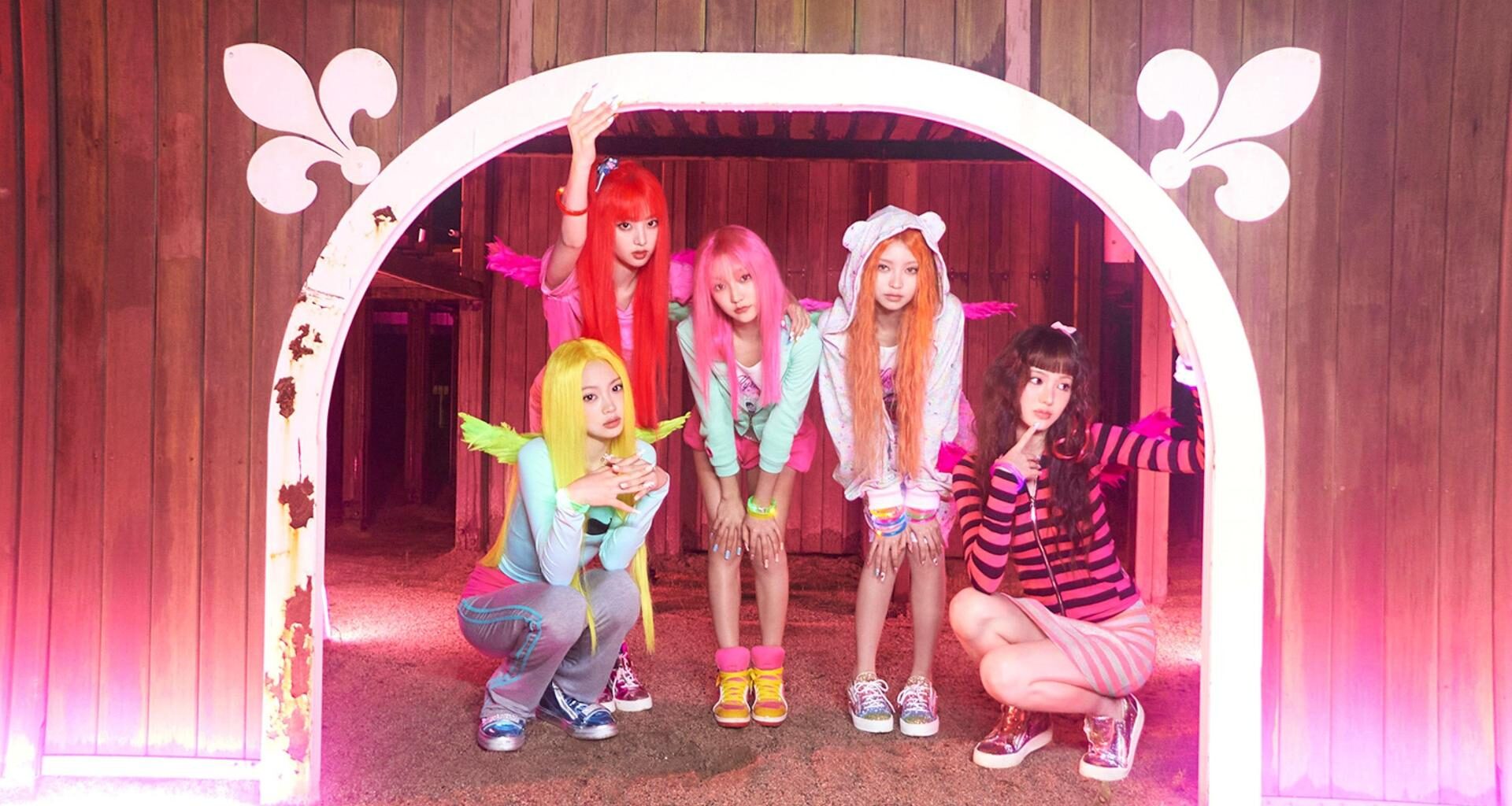 A screen capture from the official teaser for KiiiKiii’s third mini-album, WhyKiiiKiii, led by their high-energy summer title track