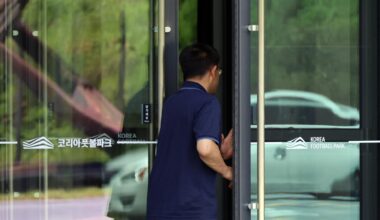 An official enters Korea Football Park in Cheonan, South Chungcheong Province, Thursday, as police conduct a search and seizure of the Korea Football Association