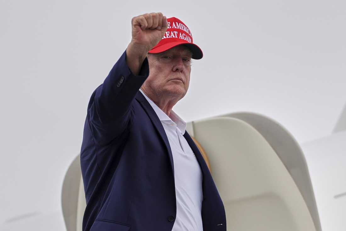 President Donald Trump gestures as he boards Air Force One at Morristown Airport, Sunday, Aug. 16, 2026, in Morristown, N.J.