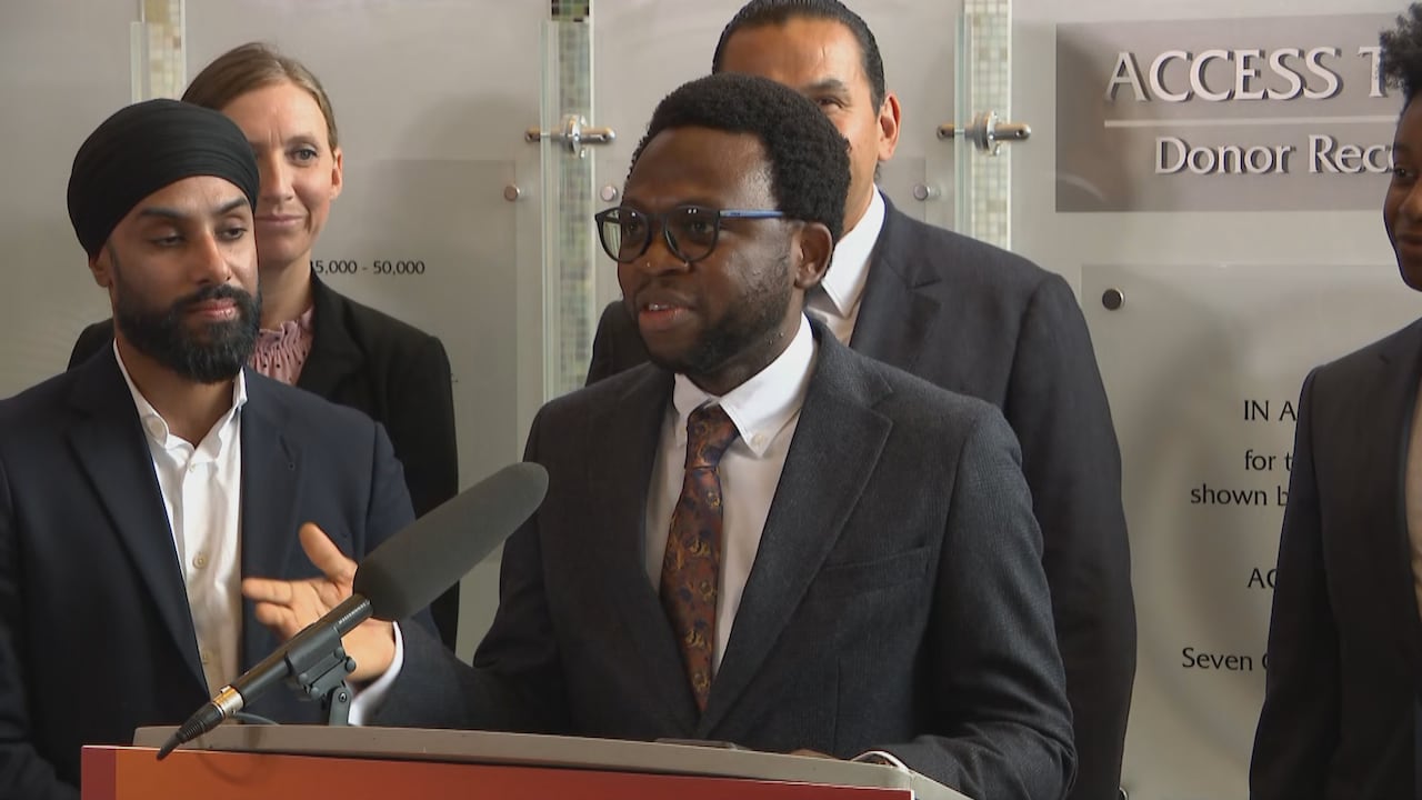 A man standing behind a podium.