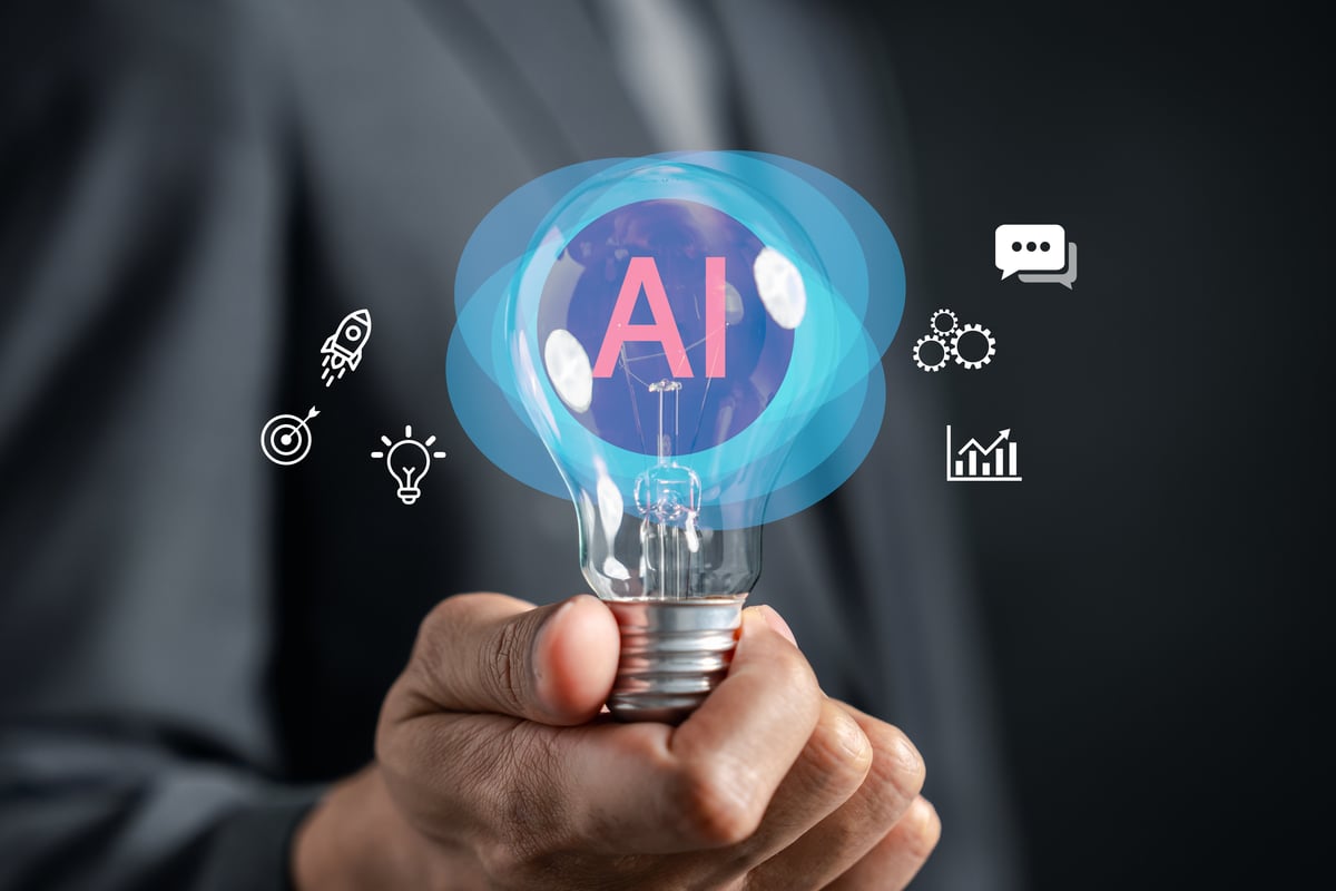 A light bulb with the letters AI inside of it and graphics around it.