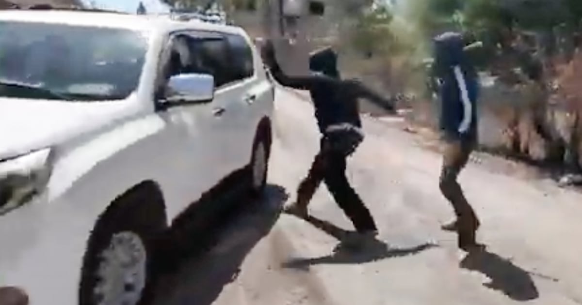 Masked Israeli settlers attack Palestinian woman, NBC News team in West Bank