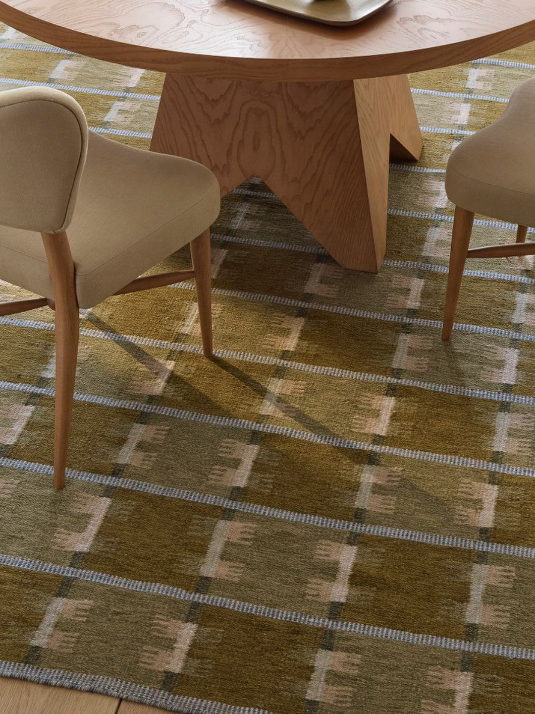 A patterned green rug from West Elm x Pierce &amp; Ward
