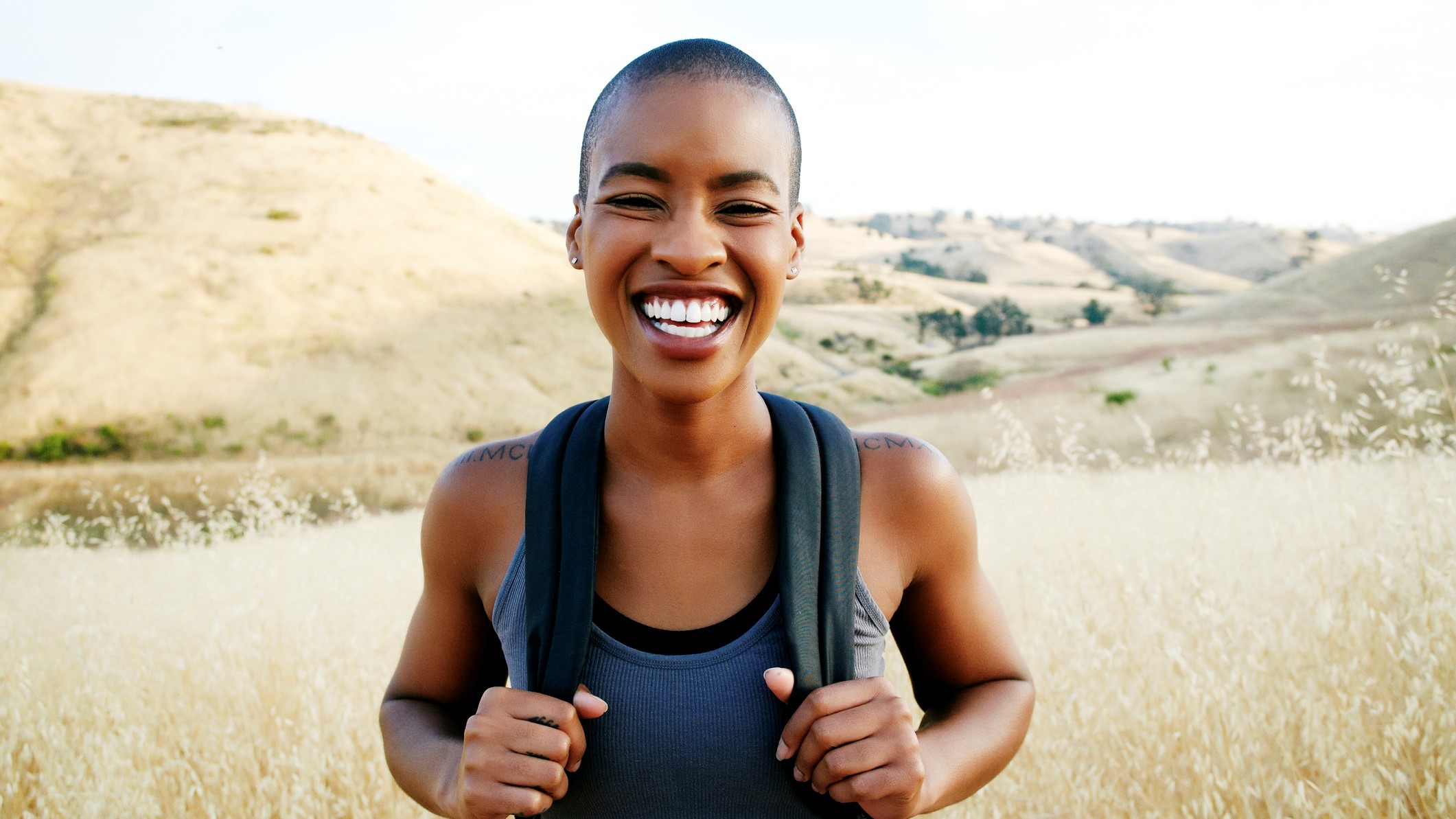 A woman smiling while walking