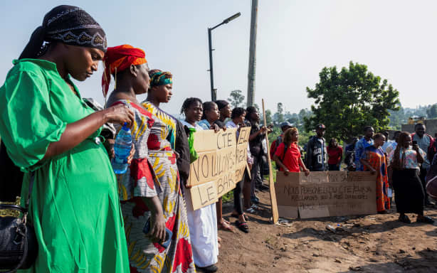 Health workers demonstrate outside the Elikya Ebola Treatment Center, demanding payment of overdue pay, following a visit by the country's prime minister, in Bunia, on July 25.