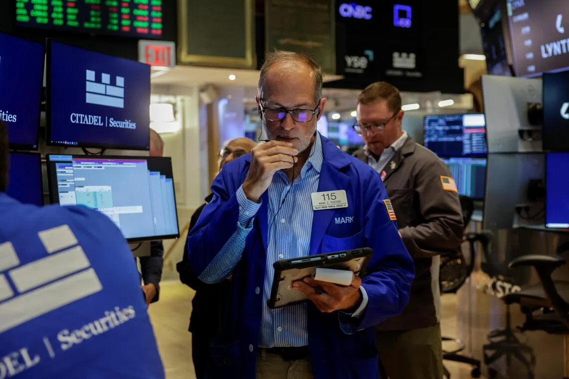 A trader working on the floor of the New York Stock Exchange, in New York City, on Aug 19.