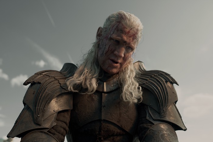 Matt Smith as Daemon in House of the Dragon season 3 Matt Smith as Daemon in House of the Dragon season 3. He's in armour, with his face bloodied.