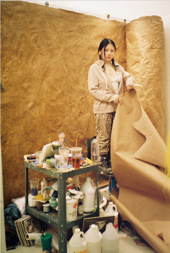 Nguyen Thu Anh, known professionally as Hoai, sets up an exhibition in her studio in Brooklyn, New York. Photo courtesy of Nguyen Thu Anh