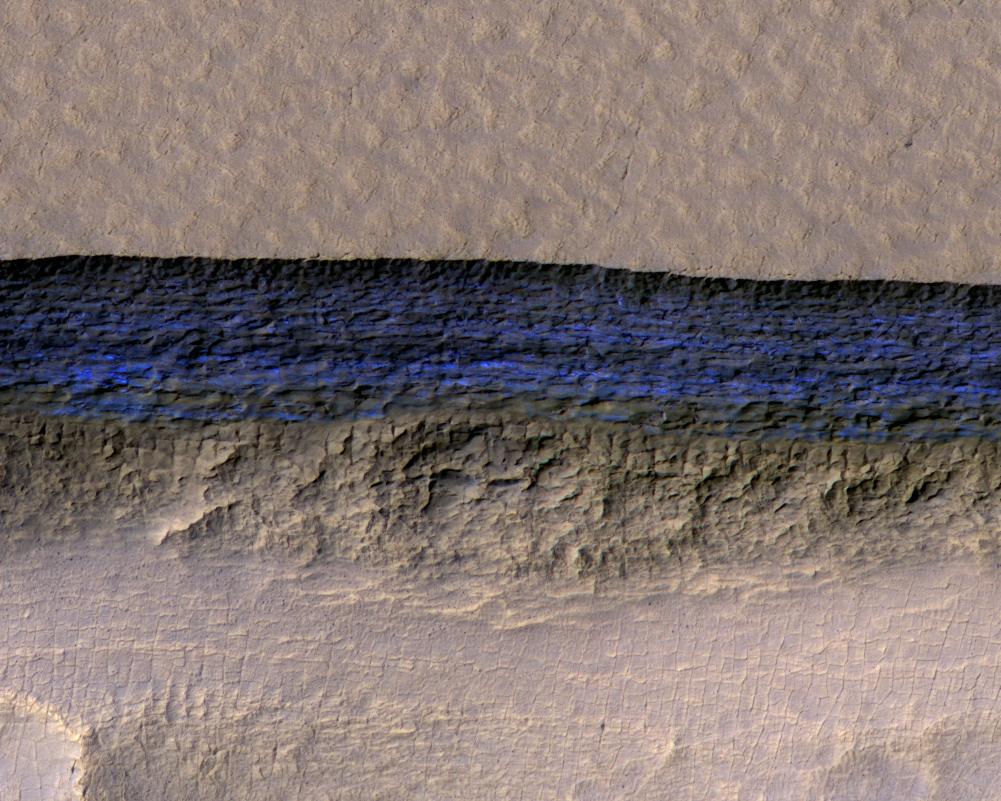 A cross section of buried Martian ice, exposed in bright blue where a steep slope has eroded away. HiRISE on Mars Reconnaissance Orbiter caught this one at 56 degrees south, the right latitude for ice, the wrong one for astronauts (Credit : NASA/JPL-Caltech/UA/USGS)