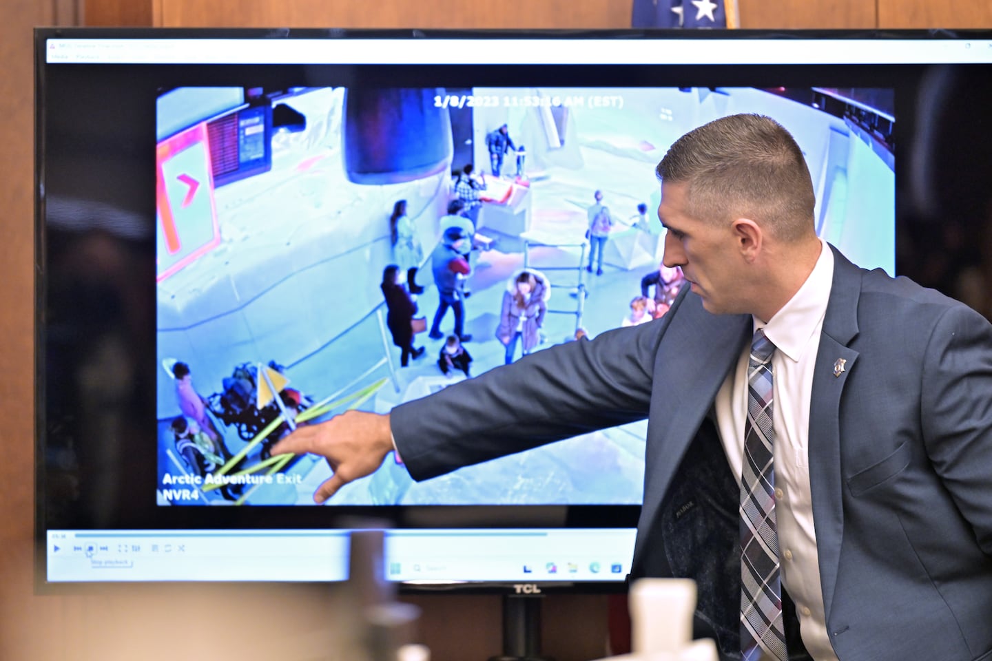 In the courtroom, State Trooper Joshua McKelligan pointed to the Clancy family in a video showing their visit the Museum of Science.