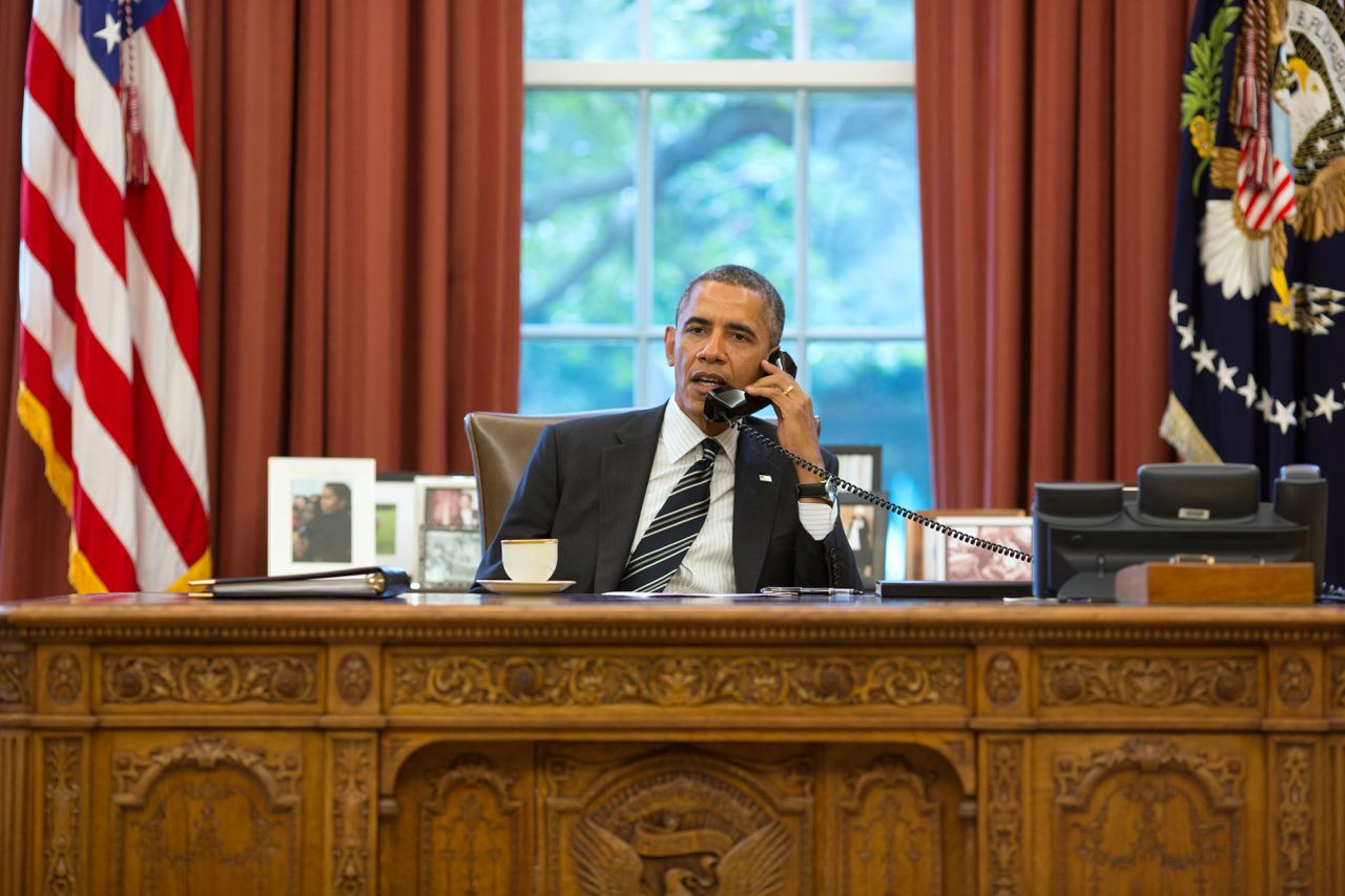 US President Barack Obama speaks with President Hassan Rouhani of Iran during a phone call in the Oval Office on September 27, 2013.
