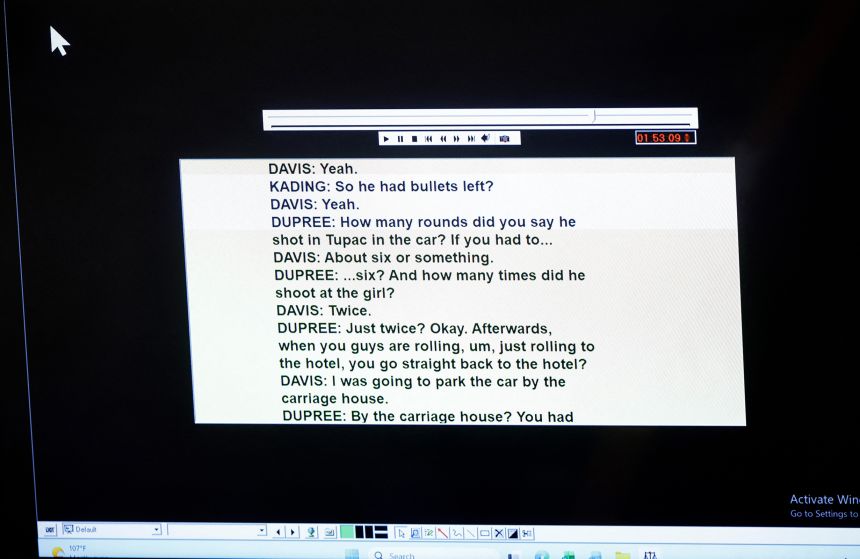 A screen shows a transcript of a 2008 recording of an interview with Duane Davis and law enforcement, as it is played during Davis' murder trial on Thursday.