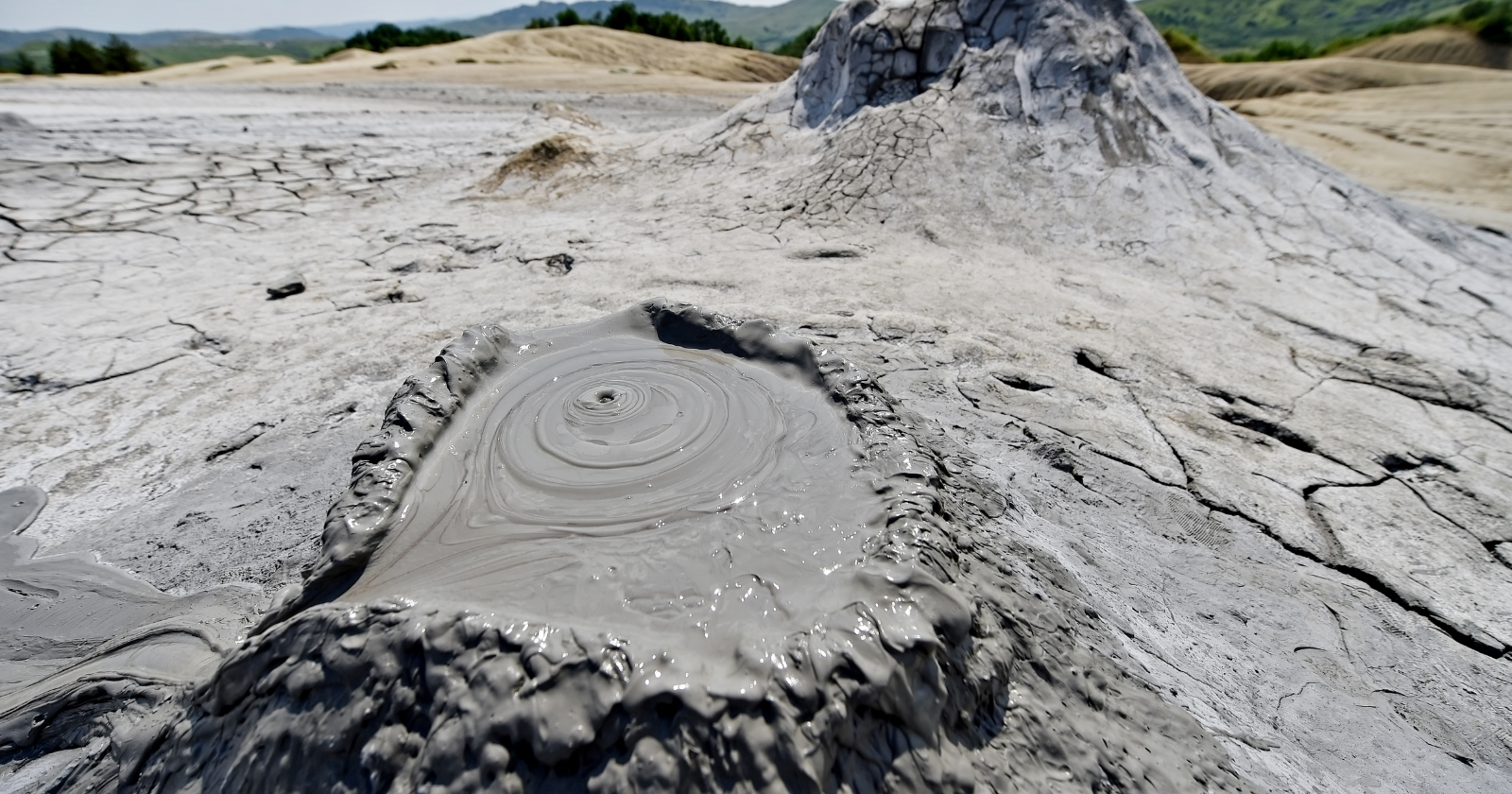 Microbes are living at pH 12 — roughly the alkalinity of bleach — inside mud volcanoes on the Mariana forearc, and there are so few of them that DNA testing fails to find them at all; researchers had to identify them by the fats they left behind