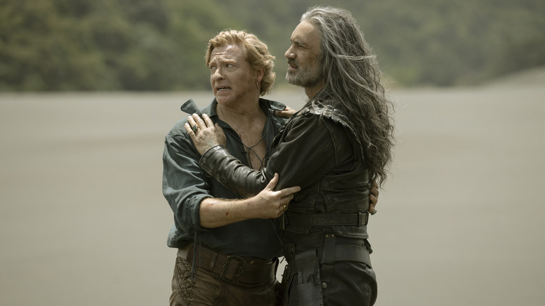 Taika Waititi and Rhys Darby in character embrace in a still image from 