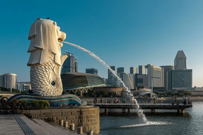 Merlion statue with modern buildings in the background in Singapore. Photo from Pexels