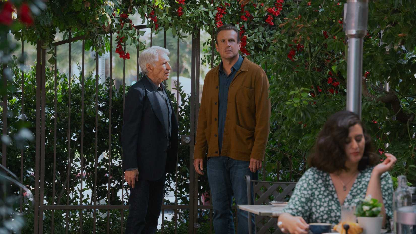 Paul talking to Jimmy outside a restaurant as he stares ahead in the Shrinking season 3 finale.