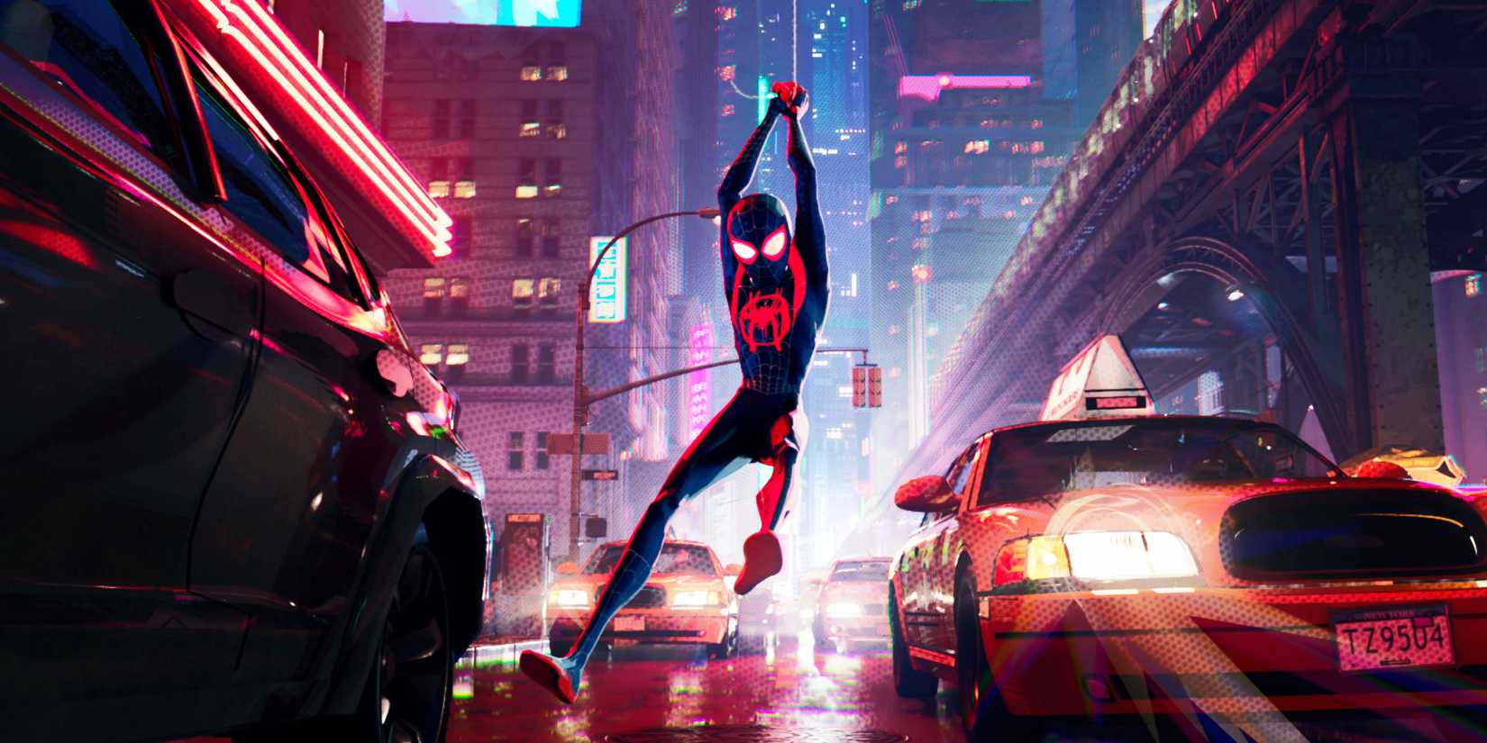 Spider-Man swinging across New York at night in Spider-Man: Into the Spider-Verse