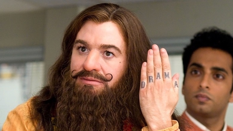 The Guru Pitka showing off his finger tattoos in 