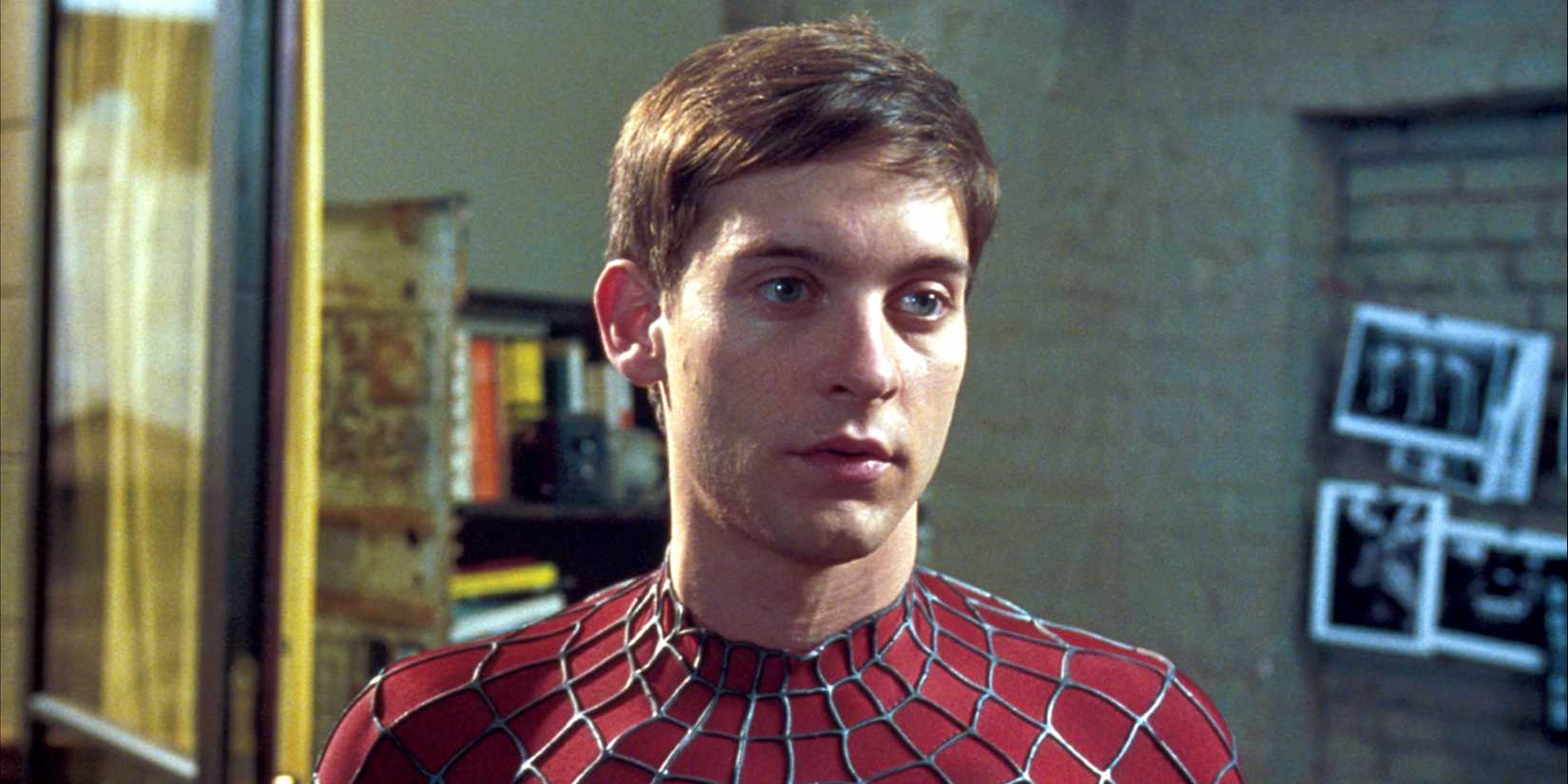 Tobey Maguire in the spidey suit staring ahead in Spider-Man, 2002.