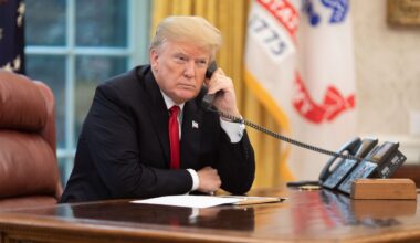 President Donald J. Trump speaks on the phone in the Oval Office.