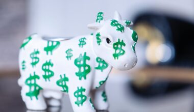 A white bull figurine with green dollar signs all over it.