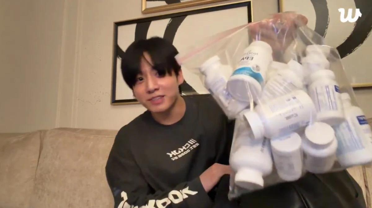 BTS member Jung Kook shows medications and supplements during a Weverse livestream. Captured from Jung Kook’s Weverse livestream